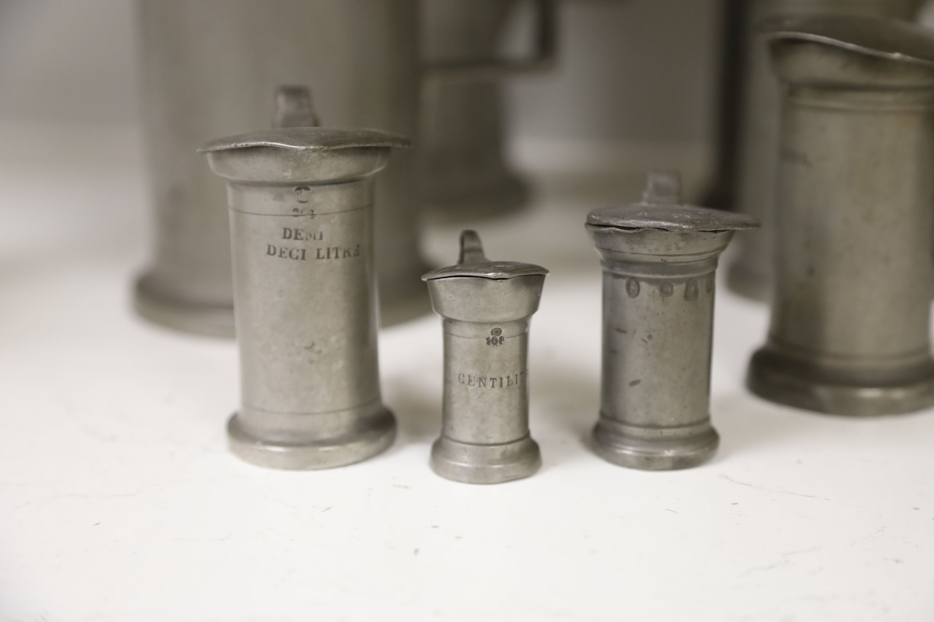 A set of eight graded French pewter measures